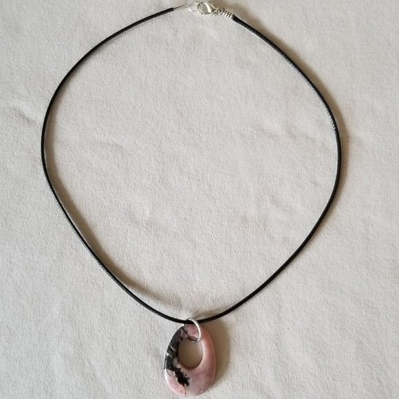 Pink rhodonite gemstone with black veining, natural pendant on a black cord. - Picture 2 of 6